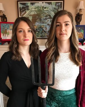 Anna (left) and her sister Julia in annual American Gothic Christmas photo